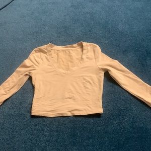 Long sleeve size XS nude cropped top